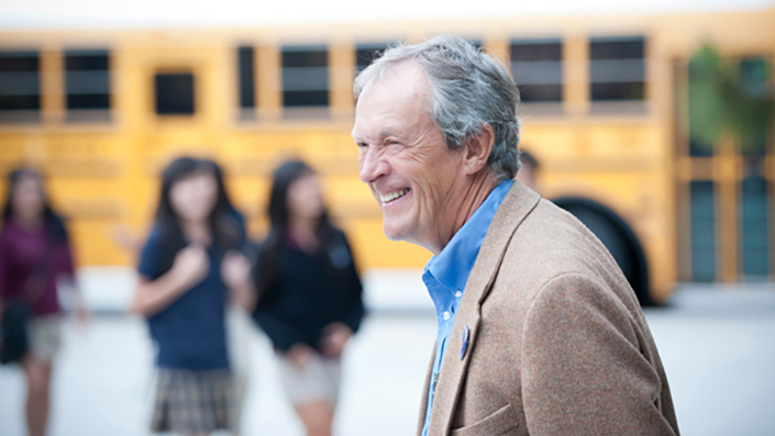 Dynes in front of a school bus