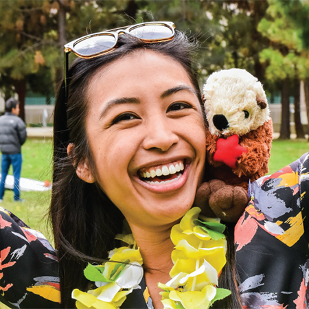 Kathleen Yamul holding an otter plushie