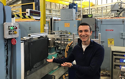 Smiling person working in a lab