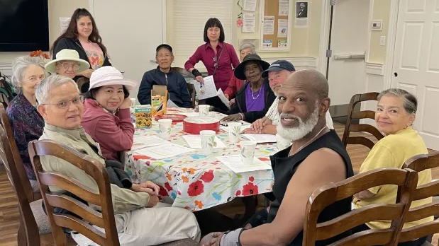 Group of people sitting around a table