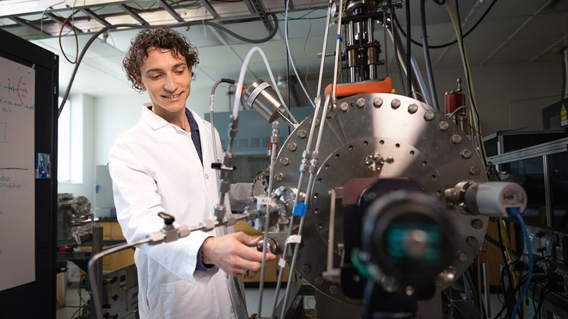 Person working with a large scientific device