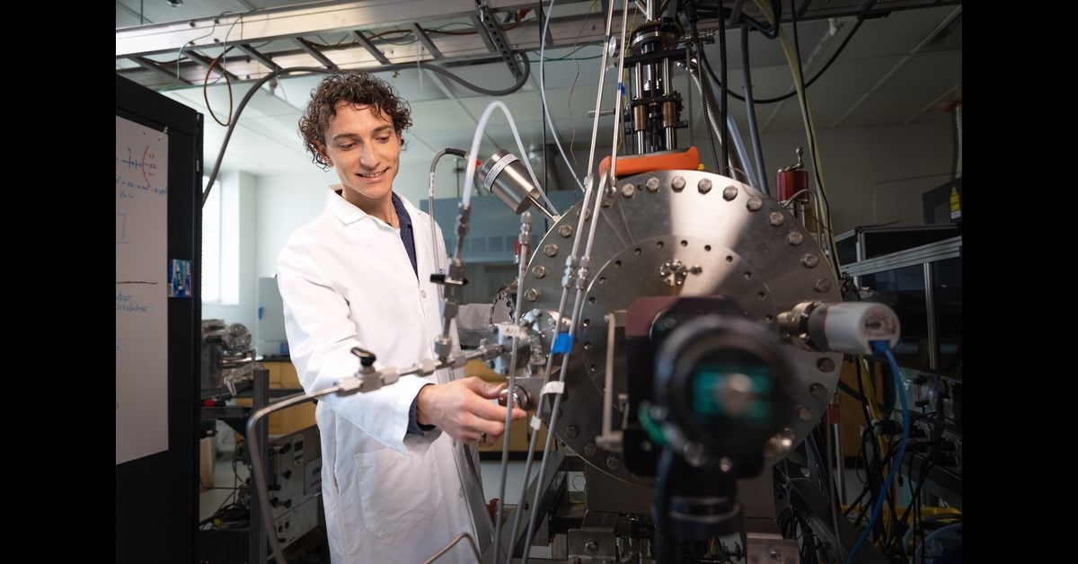 Riley Need with scientific equipment