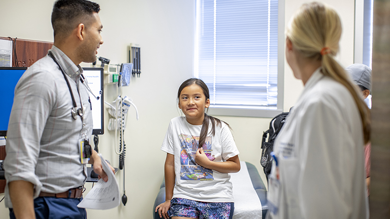 Doctors talking to a girl