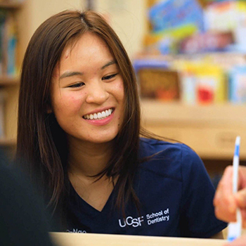 Belle Lao-Ngo demonstrating how to brush teeth properly