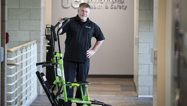 Randy Styner, UC Irvine director of emergency management, displays one of the 282 evacuation “stair chairs”