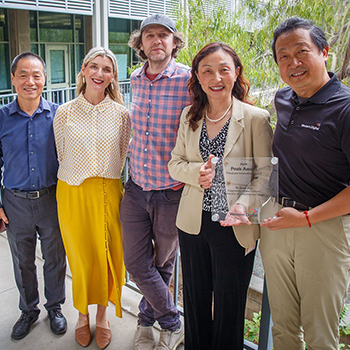Lin and Che from Western Digital present the PEAK award to Tiffany Fox, director of external relations for the Center for Epigenomics; Bogdan Bintu, assistant professor of bioengineering; and Quan Zhu, director for Spatial and Functional Genomics at the UC San Diego Center for Epigenomics. (Photo: UC San Diego)