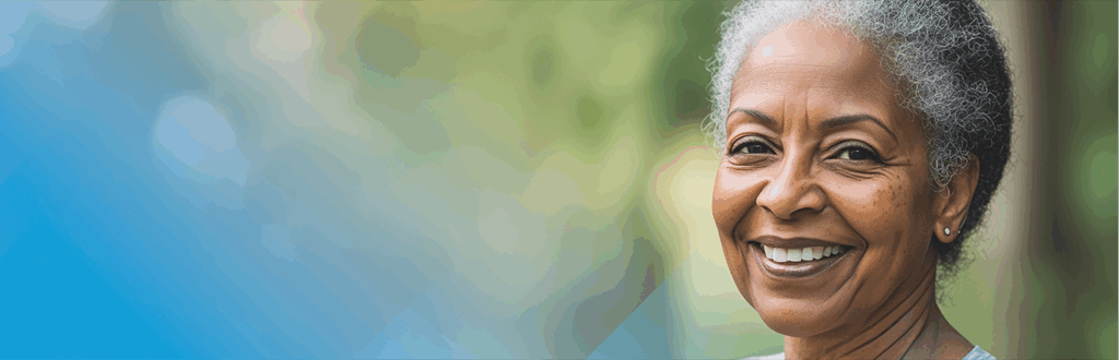smiling gray-haired person outdoors