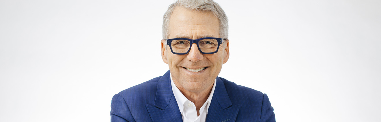 Pres. Milliken smiling, wearing a blue suit