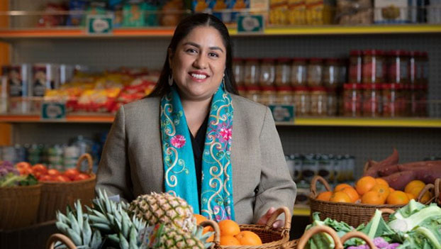 Andrea Mora holding produce