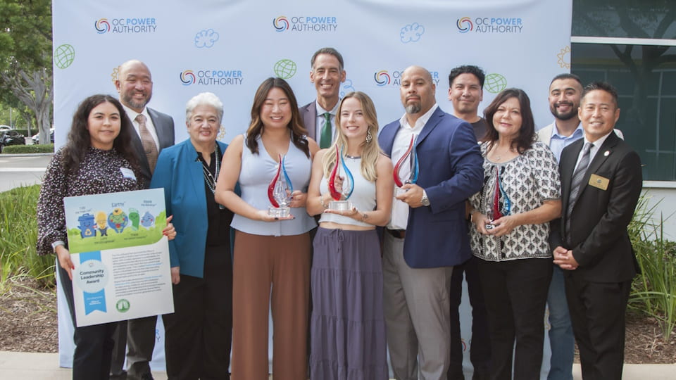 Group of people holding an award