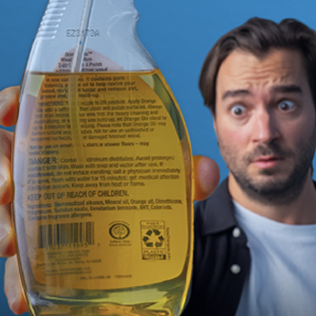 Stephen McNally holds up a household cleaner containing suspect chemicals