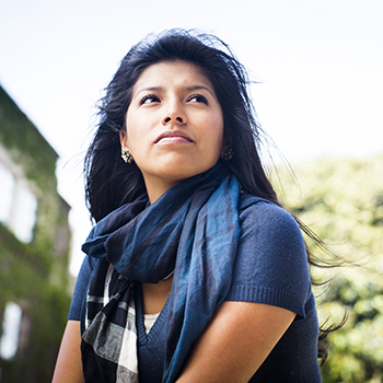Woman staring off into the distance with a determined look