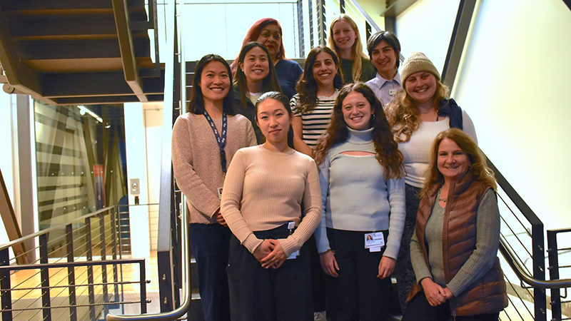 Group of women standing in a group on a staircase