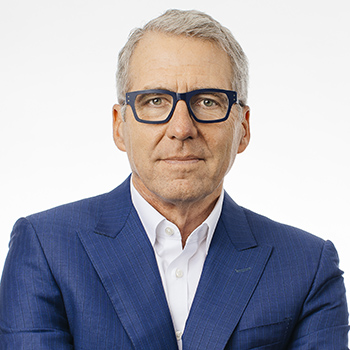 UC President James B. Milliken headshot with glasses and serious expression