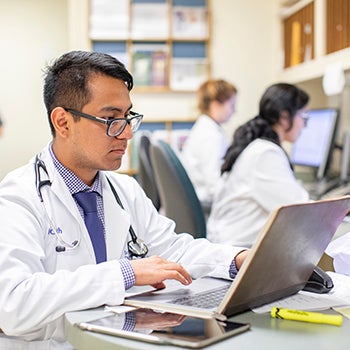 Clinical staff working on computers at the Santa Anna Family Health Clinic
