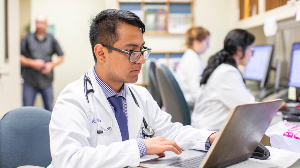 Clinical staff working on computers at the Santa Anna Family Health Clinic