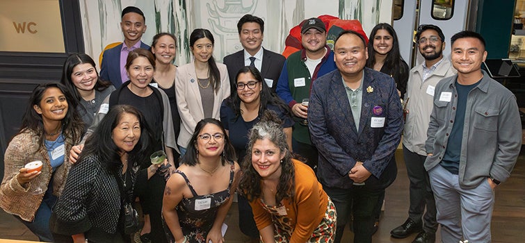 Group of smiling people standing together