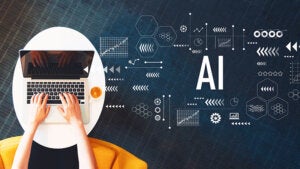 AI with person using a laptop on a white table