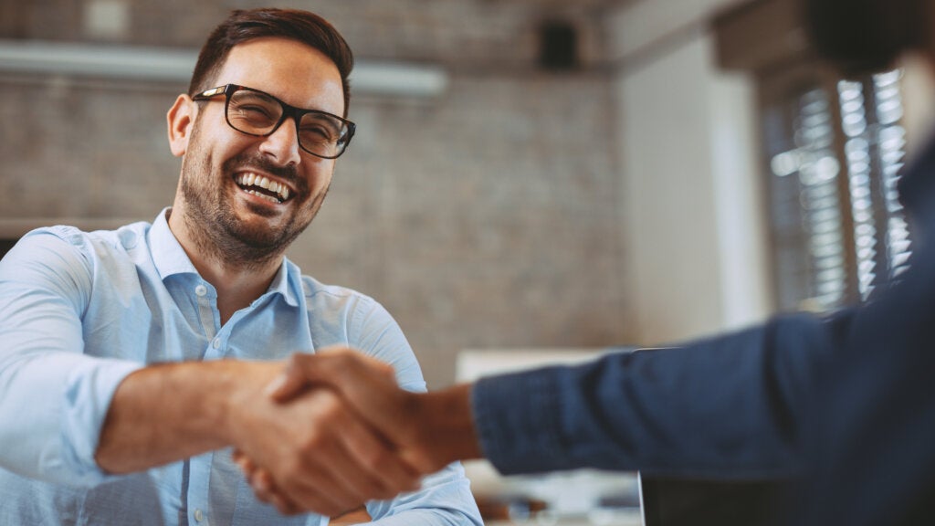 Close up of handshake in the office