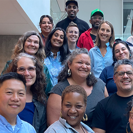 Group of smiling people standing together