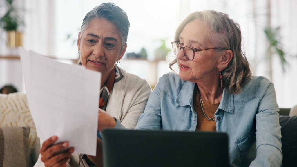 Lesbian couple working on retirement planning paperwork