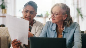 Lesbian couple working on retirement planning paperwork