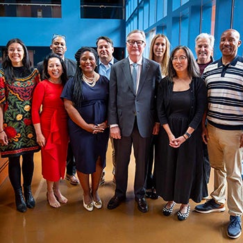 Group of people standing together in semi-formal attire