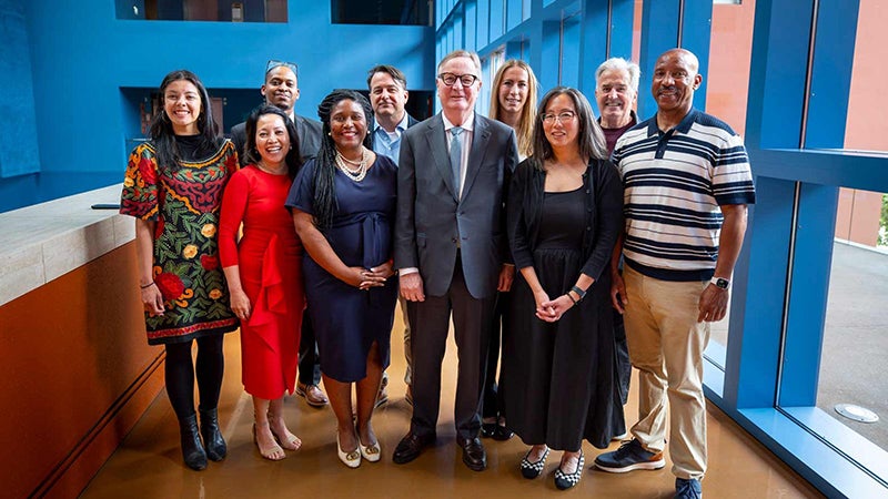 Group of people standing together in semi-formal attire
