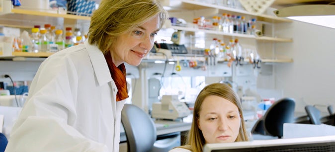 Jennifer Doudna working in a lab with an employee