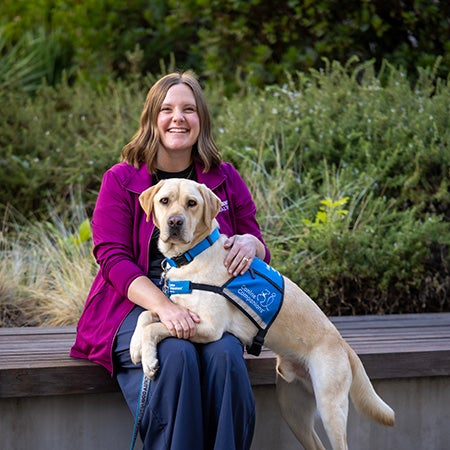 New facility dog Jerome with child life handler Sarah von Glasenapp.