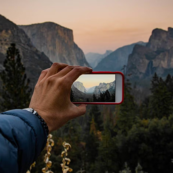 Person holding up phone to take a pic at Yosemite