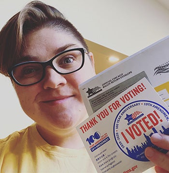 Kate Caldwell holding her voting packet